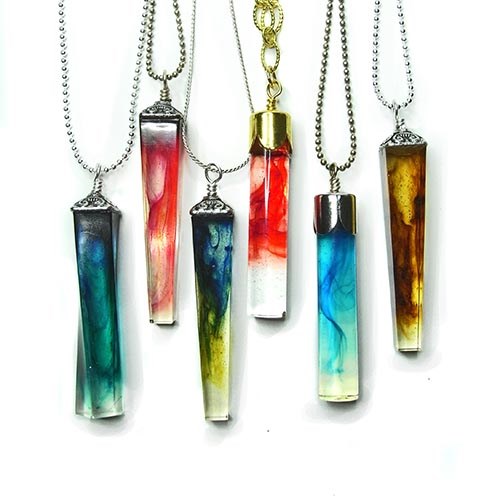 Wispy resin geometric cylinder pendants